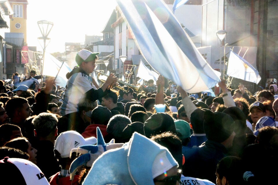 Argentina fans in iconic light blue and white jerseys celebrating at the World Cup 2026.