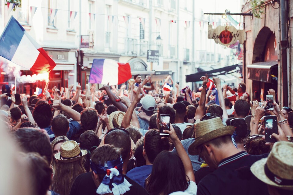 France supporters and "Les Bleus" fans cheering with national colors during a World Cup 2026 match.